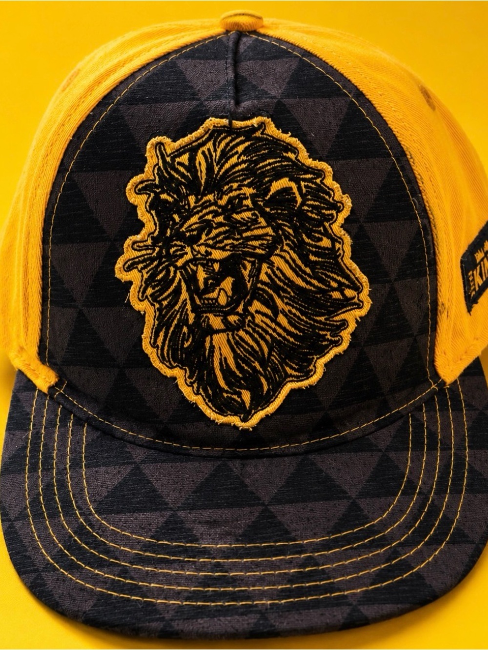 Disney Yellow and Black Lion Emblem Baseball Cap
